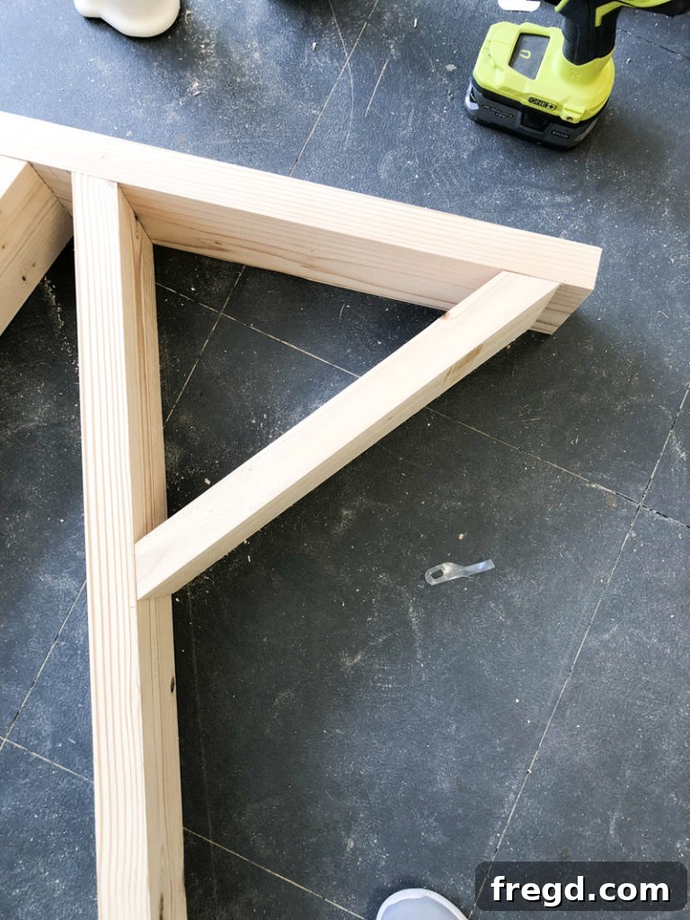 Sawhorse Chic: A DIY Modern Farmhouse Dining Table 15 Detail of a diagonal brace joint with wood glue and finish nails