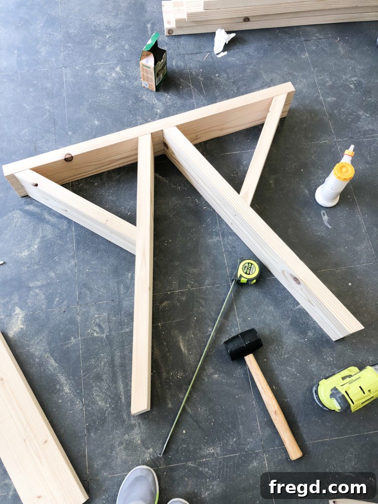 Sawhorse Chic: A DIY Modern Farmhouse Dining Table 16 Completed sawhorse leg assembly with diagonal braces for stability