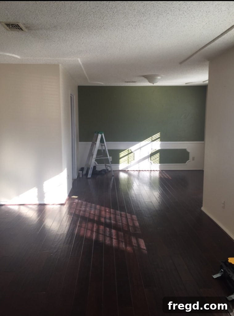 Before shot of the Berry House's front room, which lacked purpose and closed off the rest of the house.