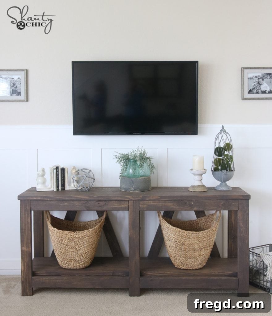 After photo showing the living room furnished with custom DIY floating shelves with pulleys, adding storage and industrial style.
