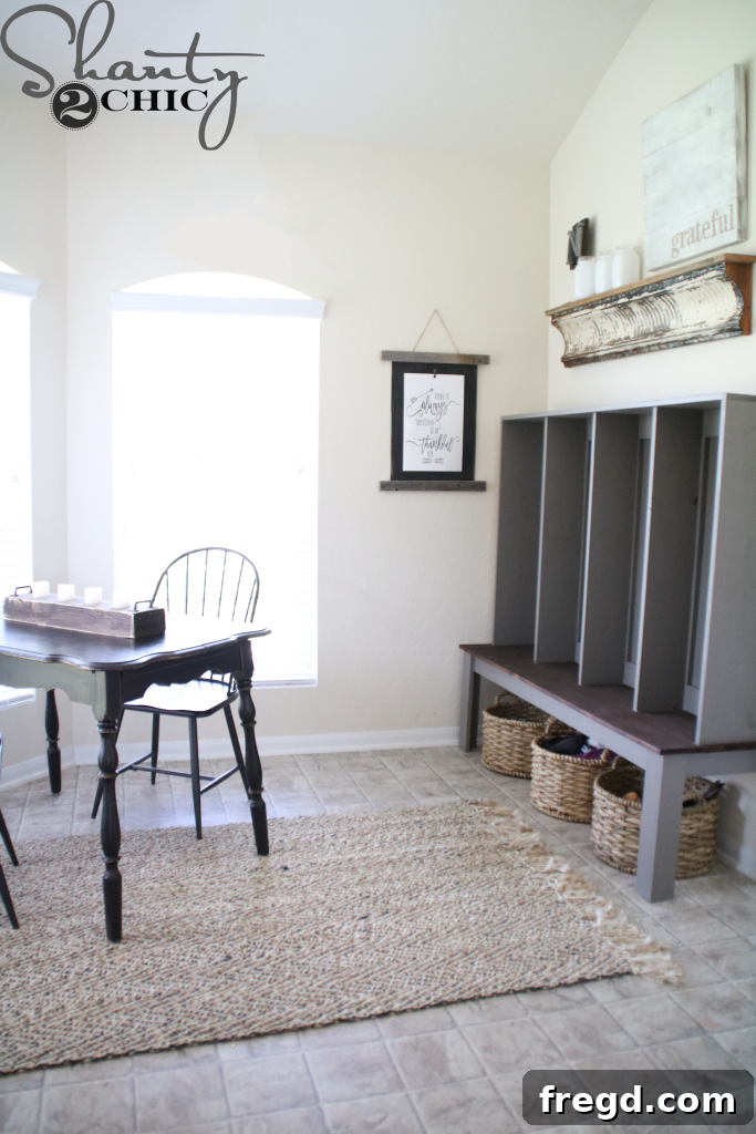 After shot displaying a functional and stylish mudroom locker, providing organization for coats and shoes in the sister's home.