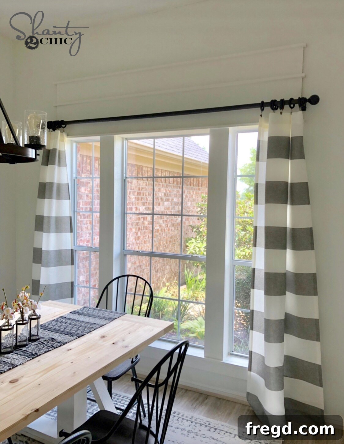 After photo showing the transformed dining room window with custom trim covering the half-circle, enhancing aesthetics and comfort.