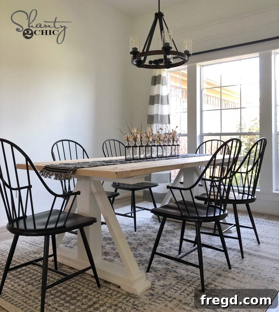 After photo of the dining room featuring a custom DIY modern farmhouse dining table, creating a warm and inviting atmosphere.