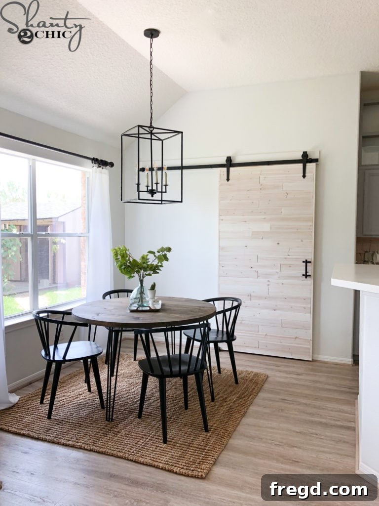 After photo of the kitchen pantry area with a new sliding barn door, saving space and adding a stylish element.
