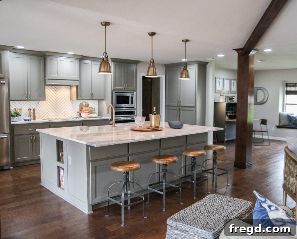 After photo of the Davis kitchen, now completely open to the living room, featuring a large island and seamless flow.