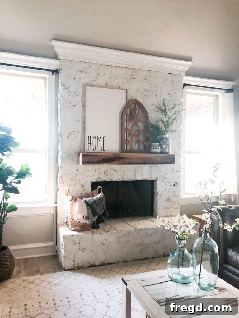 After photo of Whitney's fireplace, transformed with a German schmear finish, appearing brighter and more modern.