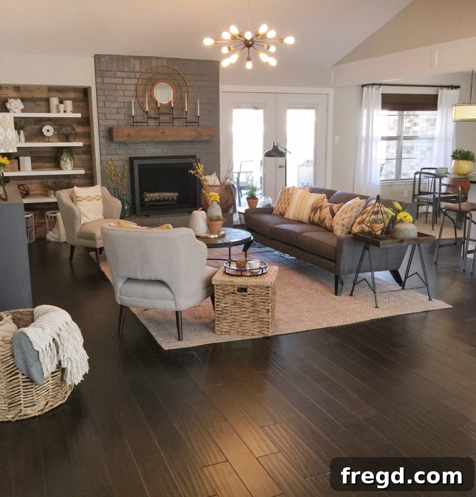 After photo of the Berry House kitchen, now open to the living room, featuring a large island and modern finishes.