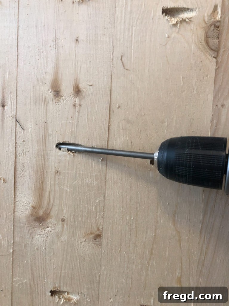 Assembling the wooden planks for the crate top using 1.5-inch pocket hole screws