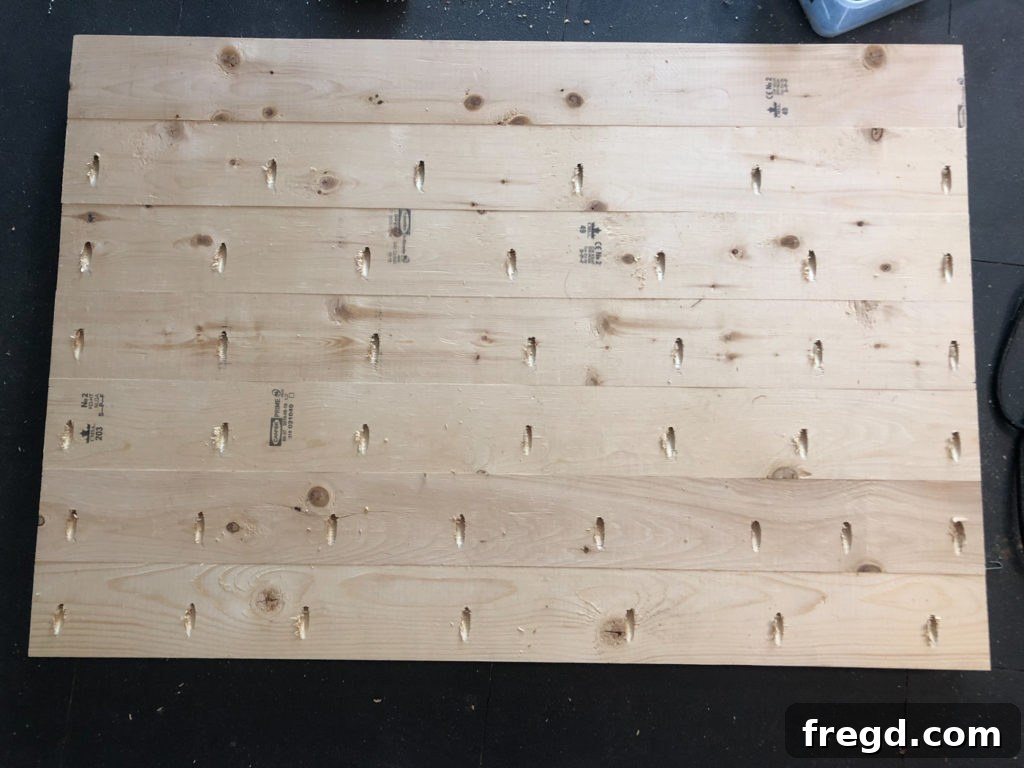 The fully assembled and finished wooden top for the farmhouse dog crate