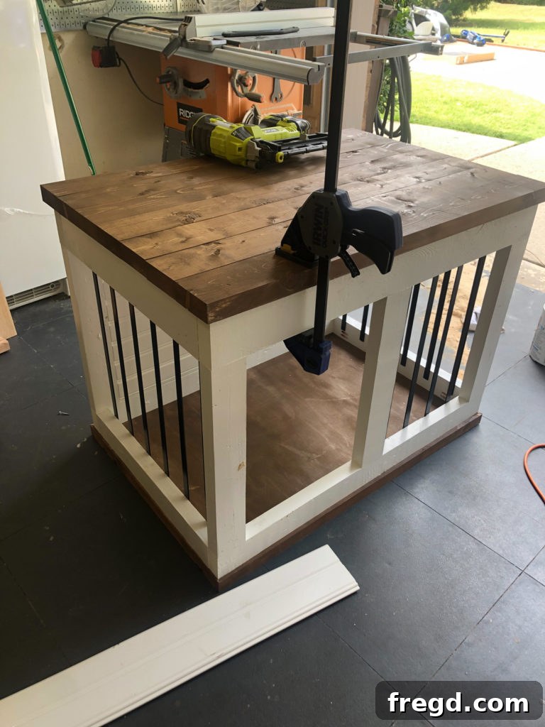Completed Farmhouse Barn Door Dog Crate with rustic charm and elegant design