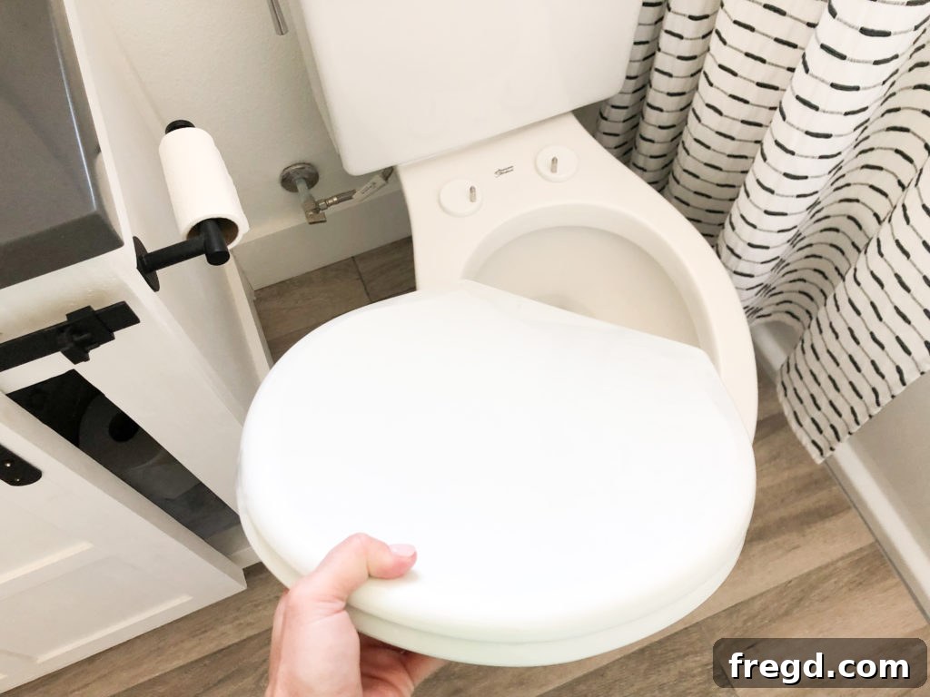 Lifting toilet seat off for cleaning