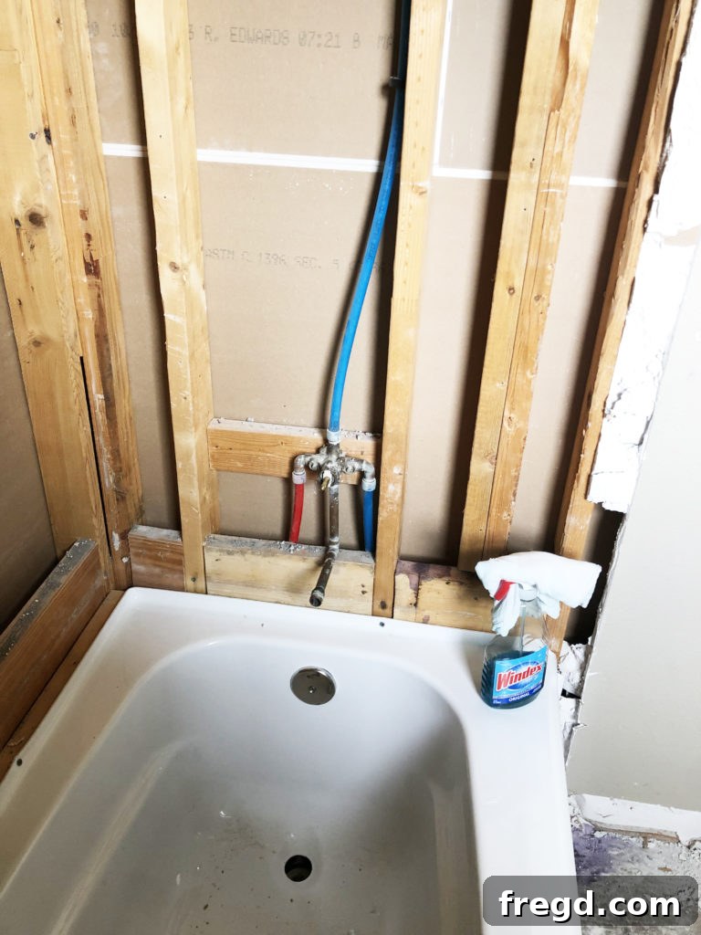New white tub installation for modern bathroom