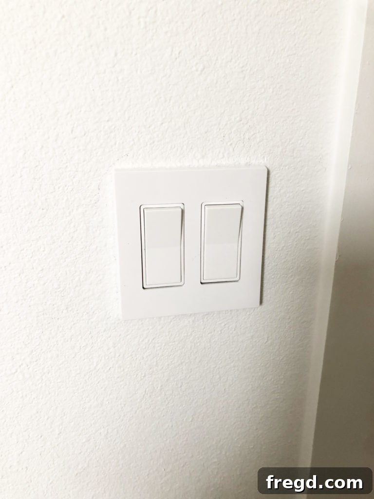 White light switch in renovated bathroom