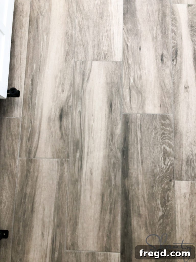 Close-up of wood-look tile and dark grout