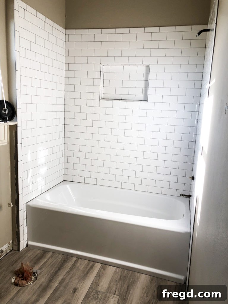 White subway tile with dark grout in shower