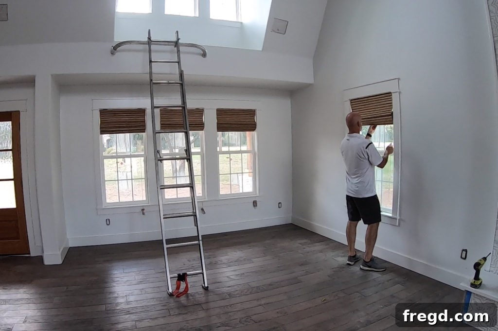 Shanty2Chic Tackles Flip House Four 5 View from inside the great room showing large windows with new Graber natural shades, showcasing the custom farmhouse trim and inviting natural light, ideal for home decor.