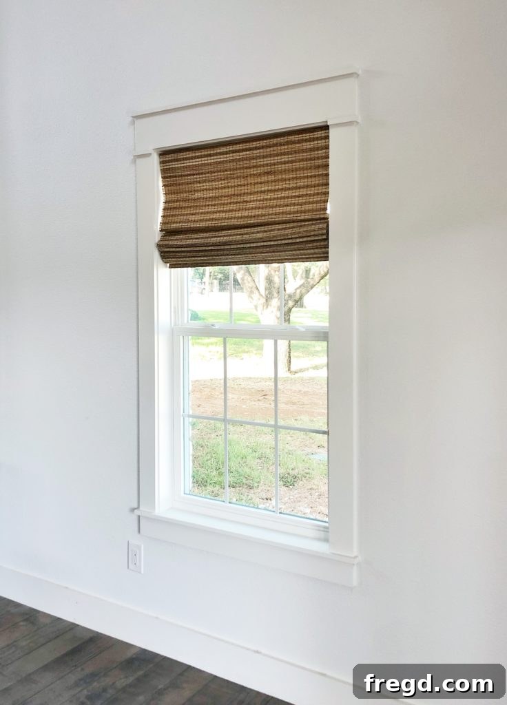 Shanty2Chic Tackles Flip House Four 10 Stylish interior shot of the great room featuring Graber window shades, blending seamlessly with the modern farmhouse aesthetic and ample natural light, creating a comfortable ambiance.