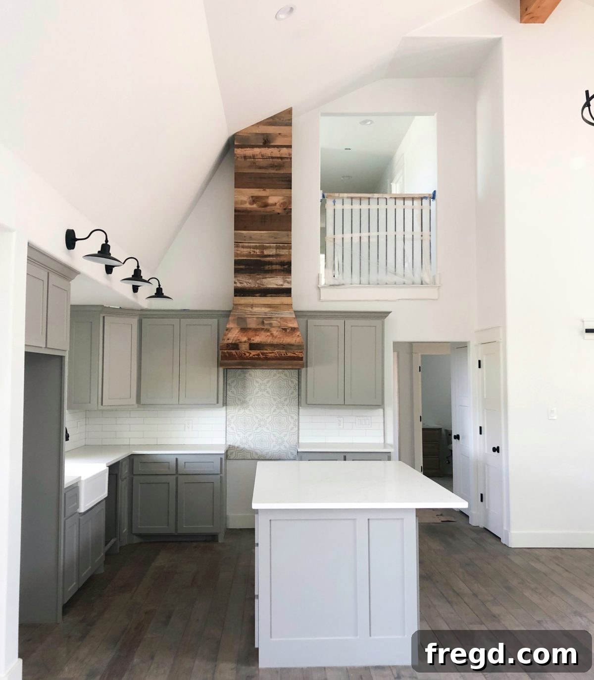 Beautifully crafted custom barn wood vent hood with a modern Broan insert in a newly renovated kitchen, showcasing rustic and contemporary design elements.