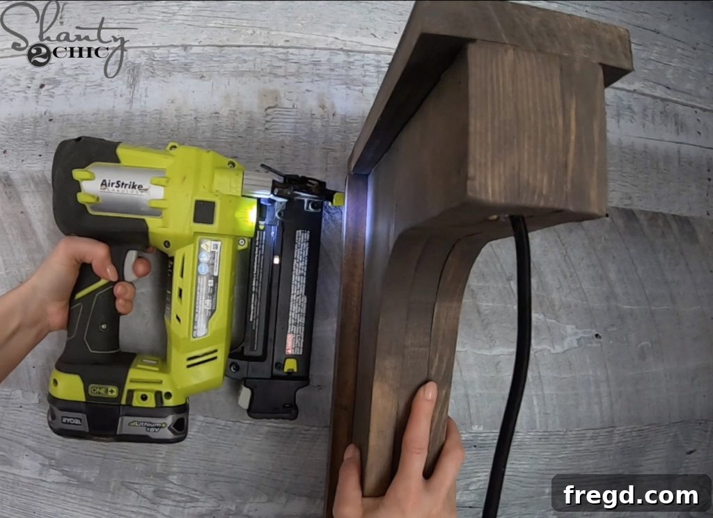 The Shanty Flip Episode 6 17 The corbel sconce being slid over and attached to the wall cleat