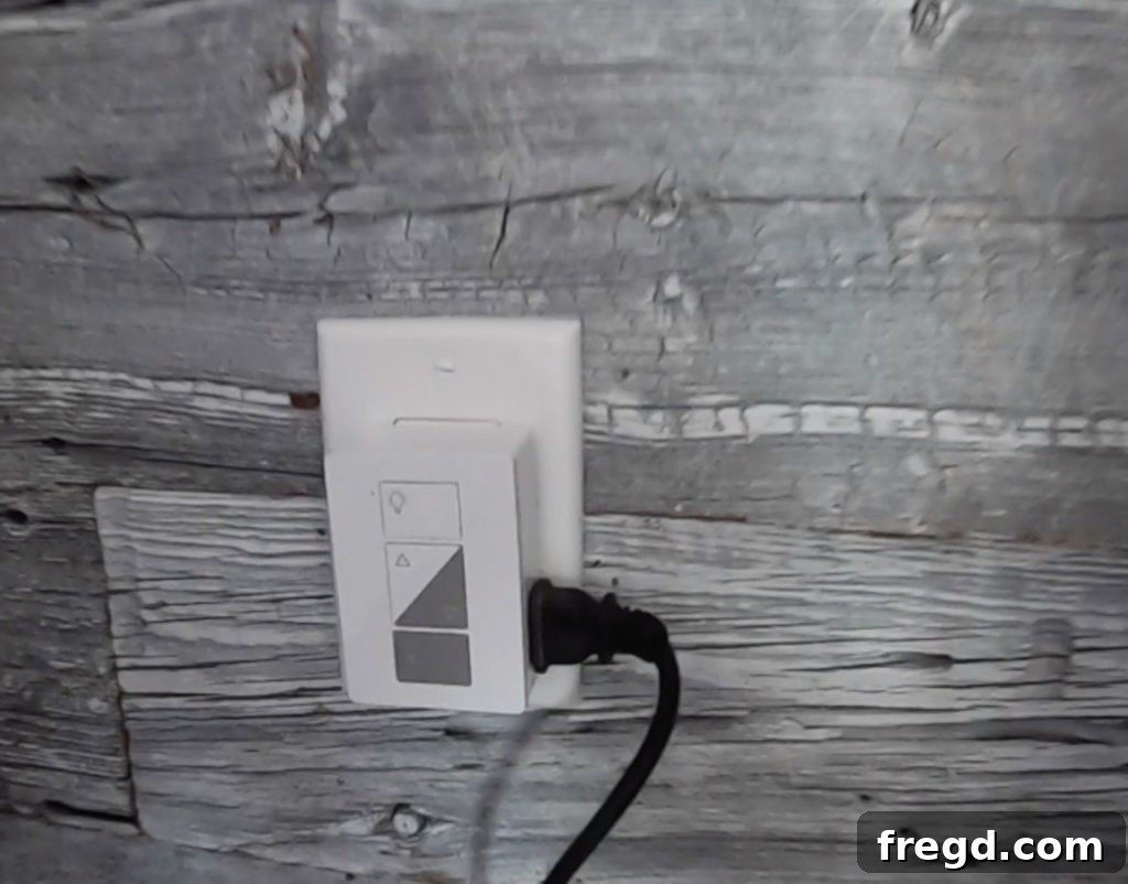 The Shanty Flip Episode 6 18 Plugging the Lutron Lamp Dimming Smart Plug into the outlet, then connecting the sconce