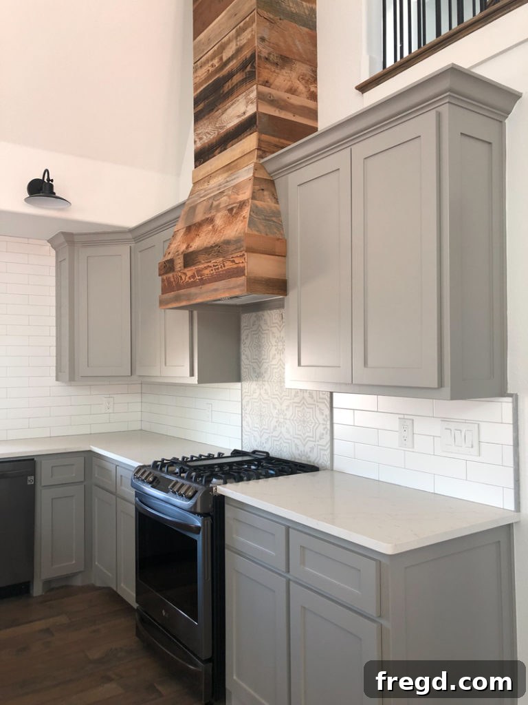 Paint Colors That Sell Your Flip House Fast 7 Kitchen island featuring Sherwin-Williams Dorian Gray cabinets and wood accents