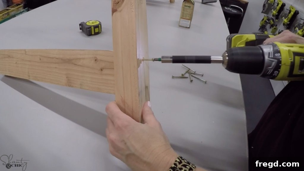 The Shanty Flip Episode 7 7 Attaching coffee table legs to the top base with 2 1/2 inch wood screws