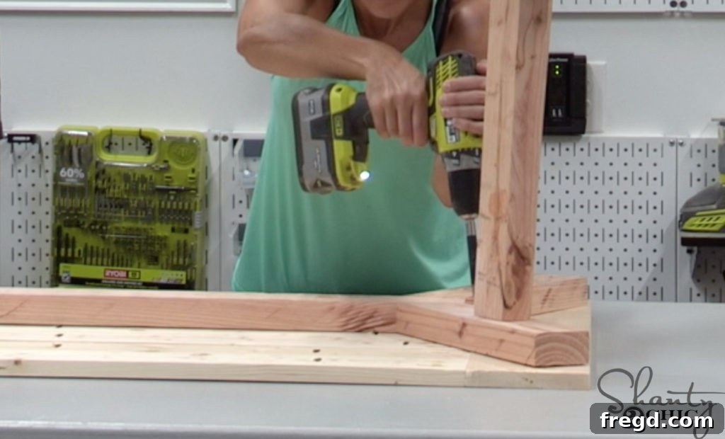 The Shanty Flip Episode 7 9 Centering and attaching the assembled coffee table base to the tabletop using wood screws