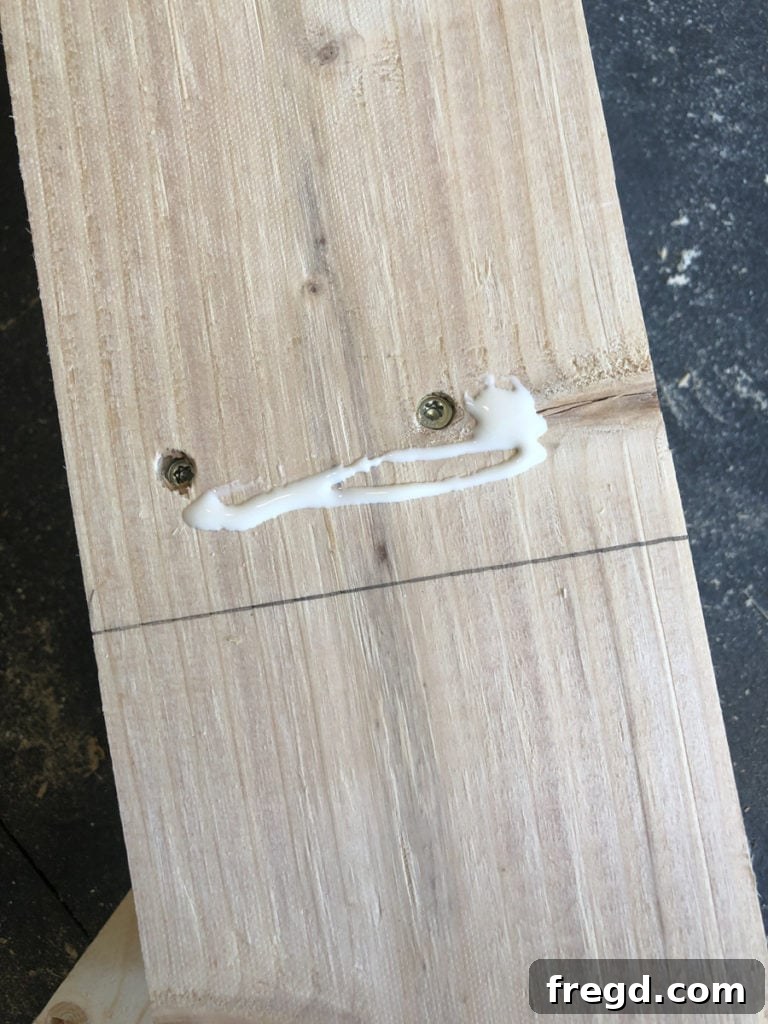 Detail shot of the lower 1x2 trim's precise alignment on a table leg.