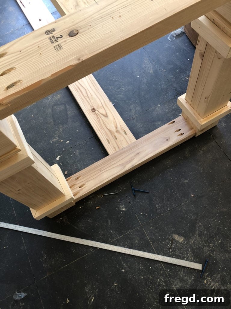Finished trim detail on the upper part of a table leg assembly.