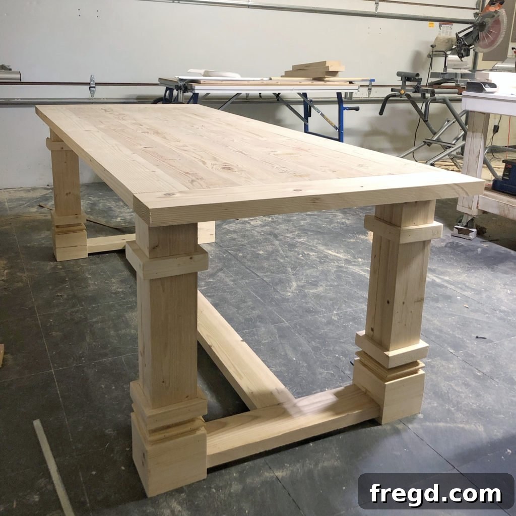 Completed table base with all runners securely attached, forming a robust structure.