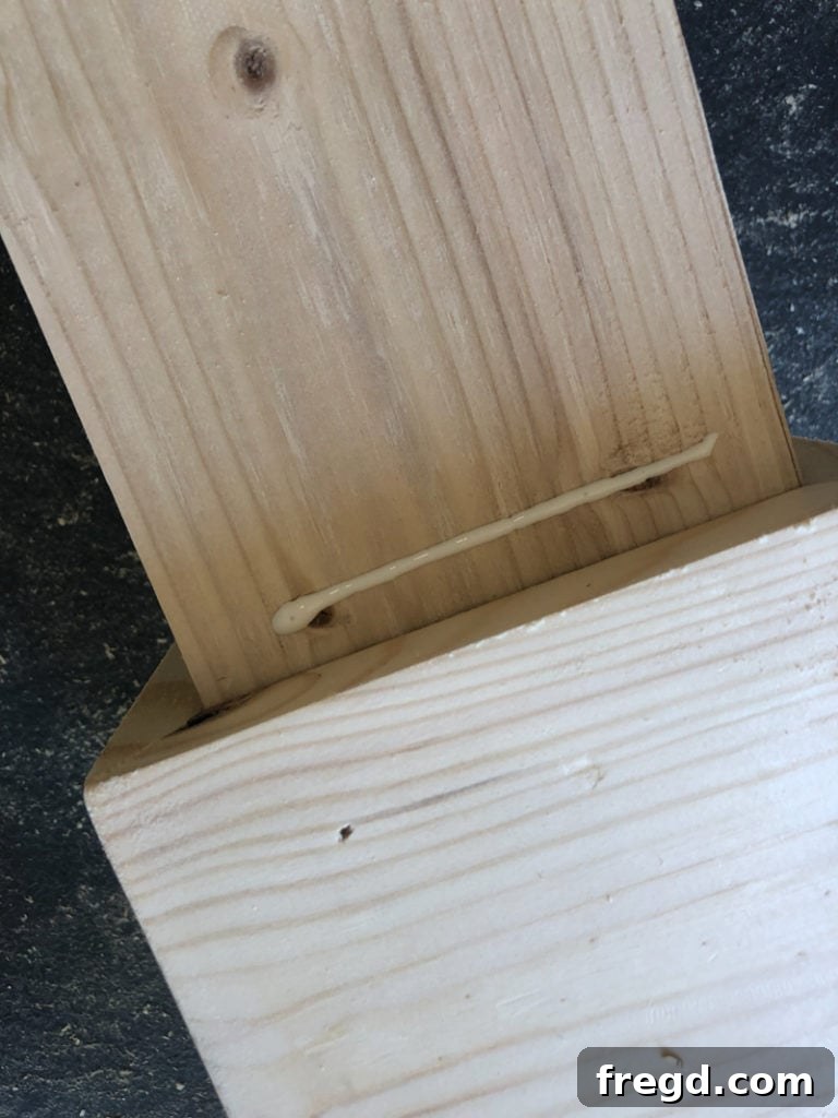 Table leg base assembly in progress, demonstrating the mitered corner joints.