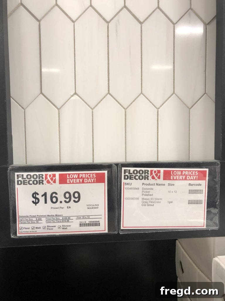 Close-up of a white textured subway tile sample.
