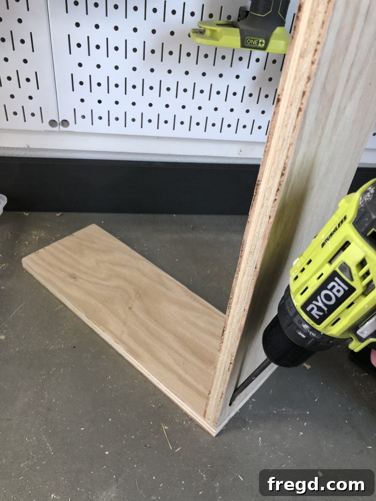 Assembling the top and middle drawers for the dog crate console
