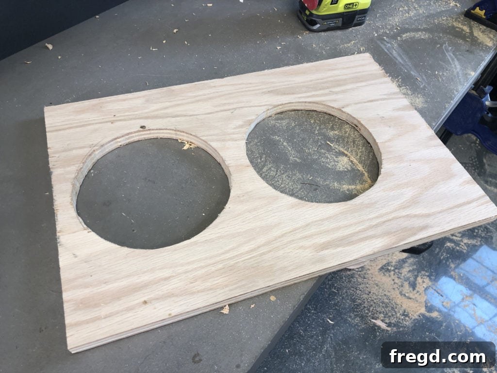 Cutting circular holes for dog bowls in the feeding drawer