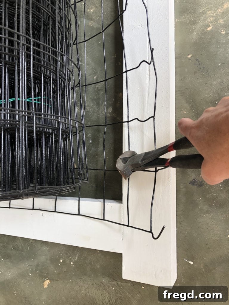 Attaching wire mesh for dog kennel ventilation