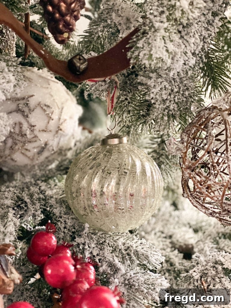 Close-up of a silver crackle French country ornament, showing its unique texture and reflective quality.