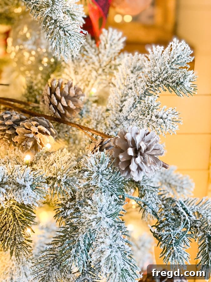 Sylvan Charm Christmas Tree 7 Detailed shot of a frosted pinecone ornament with subtle glitter.