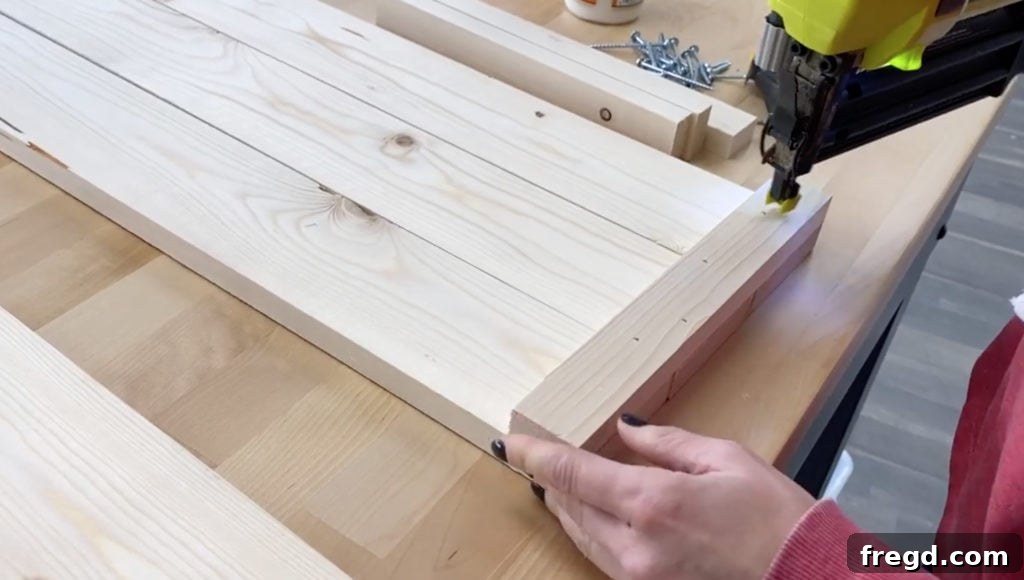 Homemade Canine Comfort 8 Side planks with vertical and horizontal trim pieces being accurately measured and attached, forming a detailed decorative side panel
