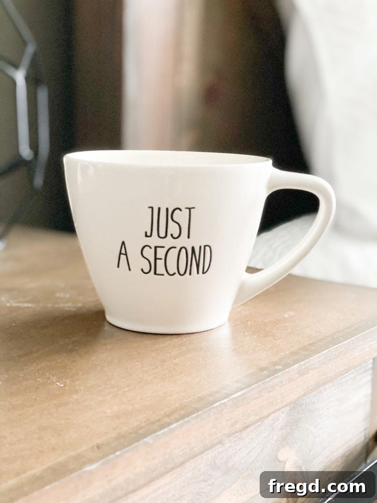 Close-up of a stylish coffee mug featuring a witty phrase, ready for a cozy morning.