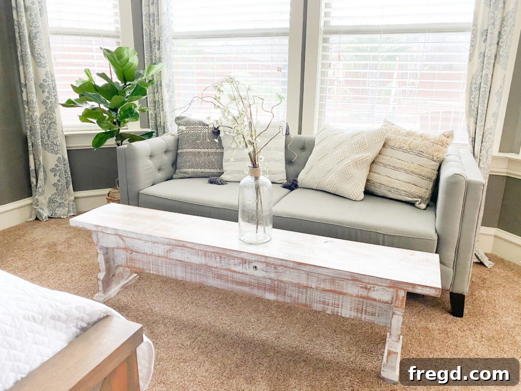 A curated collection of stylish throw pillows arranged artfully on a sitting area bench, showcasing textures.