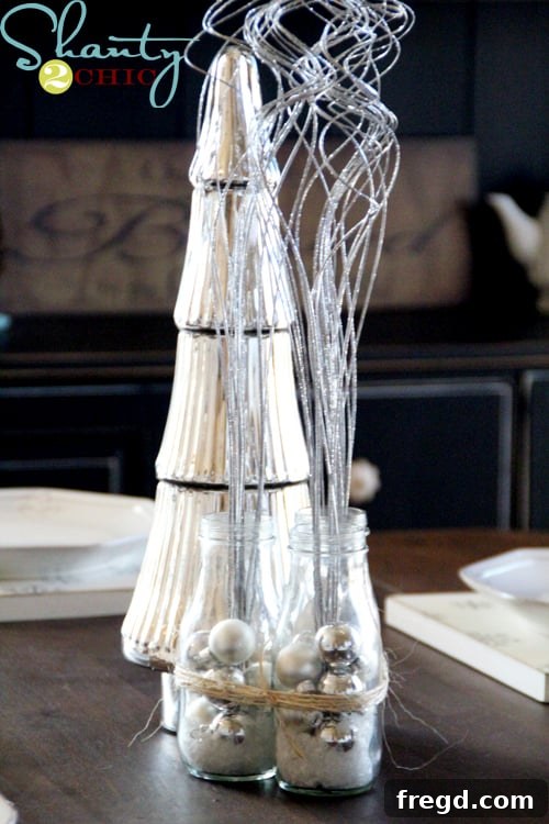 Bottles Tied with Twine Four decorated Starbucks bottles tied together with twine, forming a cohesive DIY Christmas centerpiece.