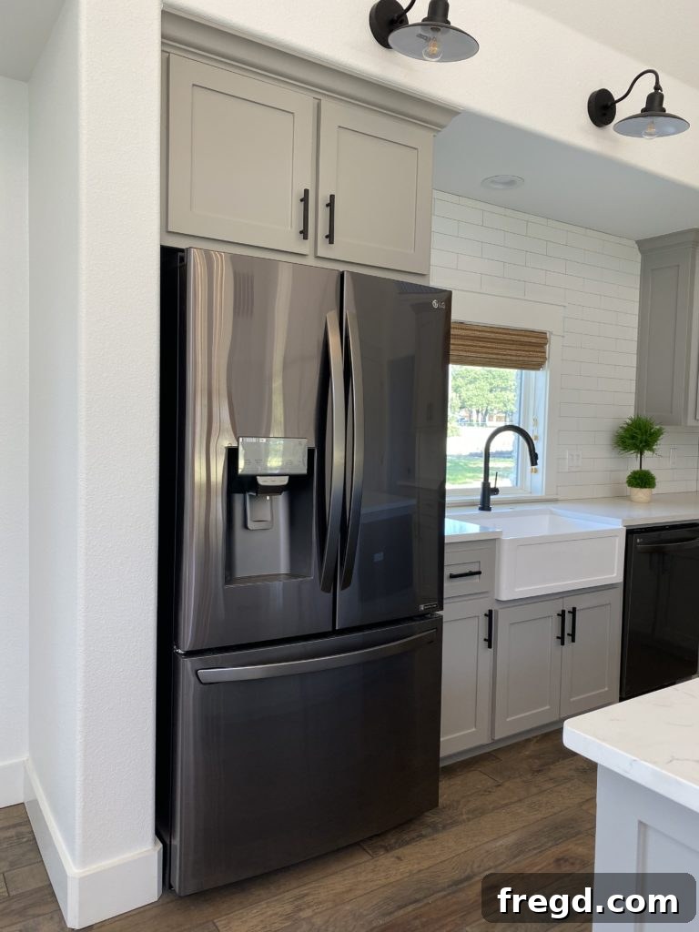 Shanty House Flip: The Nitty-Gritty Guide 11 LG 3-door French door refrigerator with a sleek, dark finish.