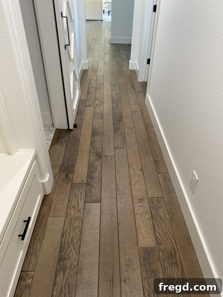 Shanty House Flip: The Nitty-Gritty Guide 3 Wider shot showcasing the Anderson Tuftex wood flooring in a renovated room.