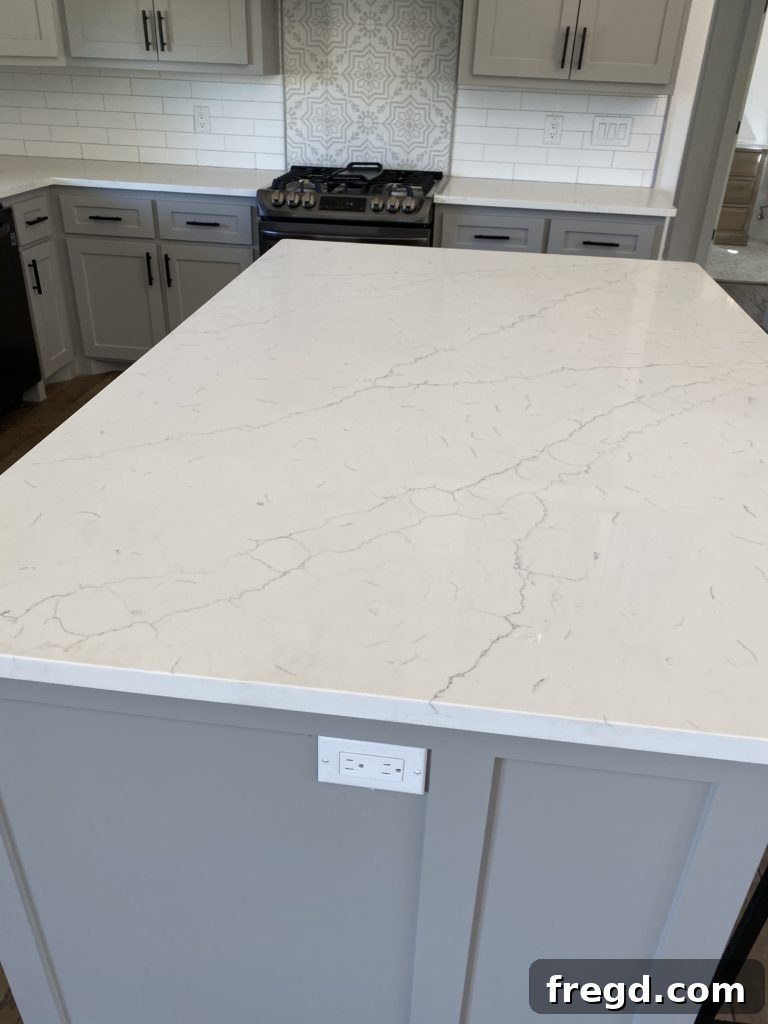 Shanty House Flip: The Nitty-Gritty Guide 9 Luxurious marble-looking Quartz countertop in the kitchen, a true showstopper.