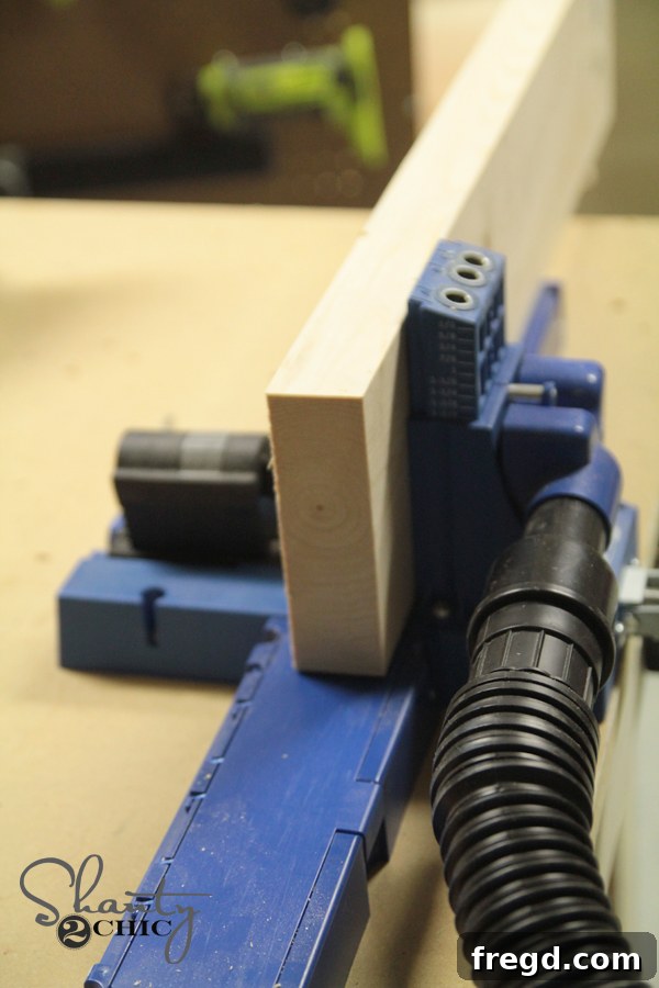 Wood planks being prepared with pocket holes for the table top.