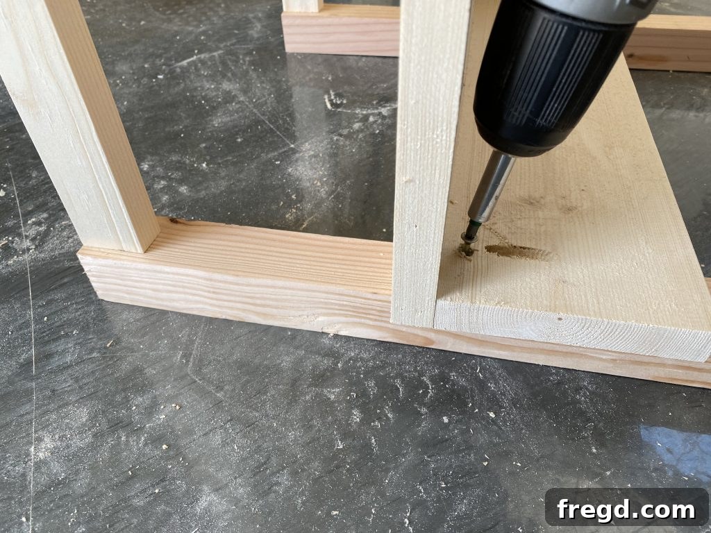Attaching the bottom shelf to the nightstand frame, ensuring proper overhang