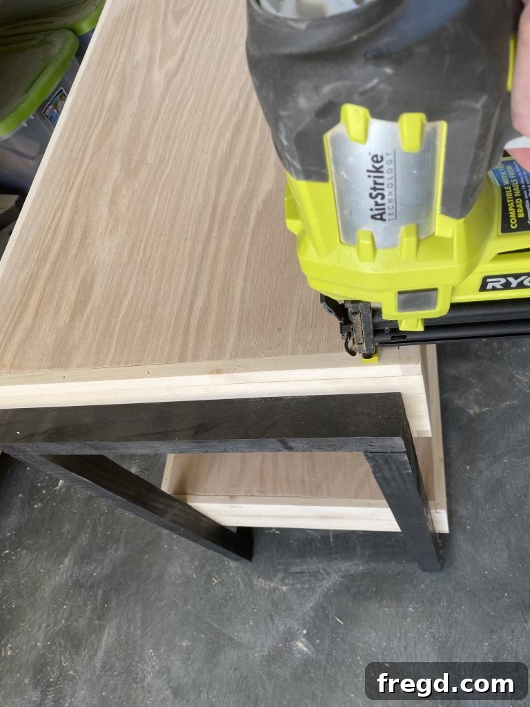 Attaching the remaining top shelf pieces after drawer installation
