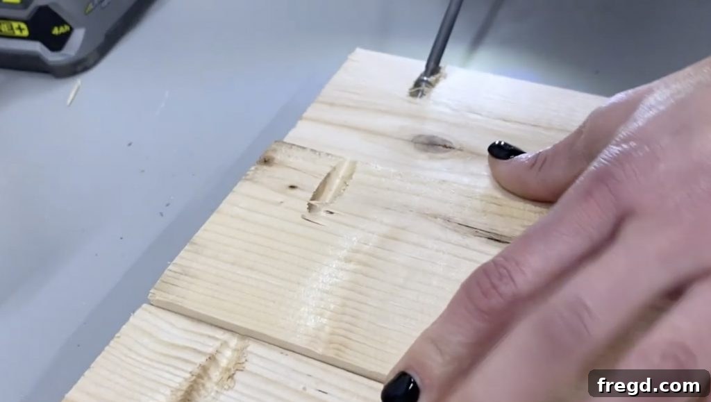 Assembled wooden planks forming the table top, secured with pocket hole screws and wood glue.