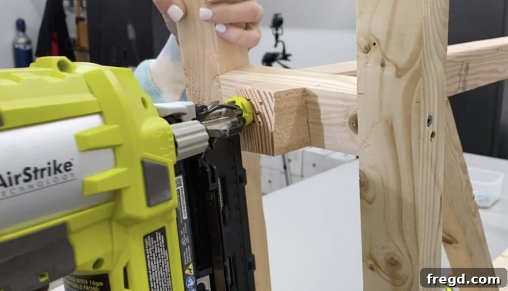 Runner extensions being attached to the bottom leg supports with finish nails.