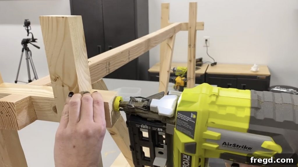 Leg extensions being secured to the outside of the main legs with finish nails, completing the angled design.